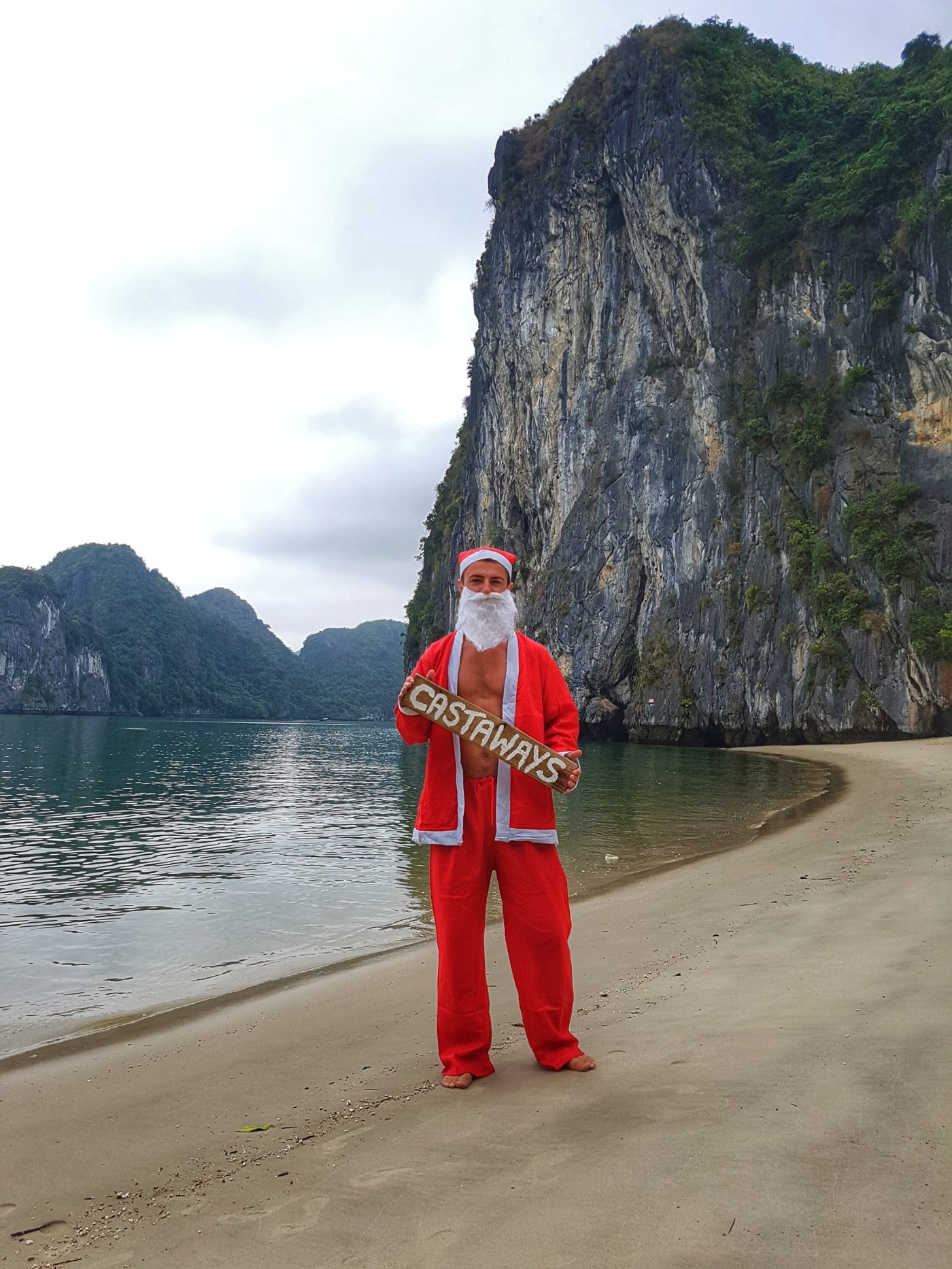 Calum dressed in a farther Christmas outfit on Castaways, Ha Long Bay