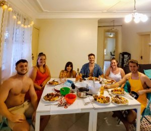 6 friends take photo before eating Christmas Dinner