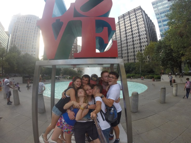 Group of friends, taking a selfie at the love sign in love park, Philadelphia
