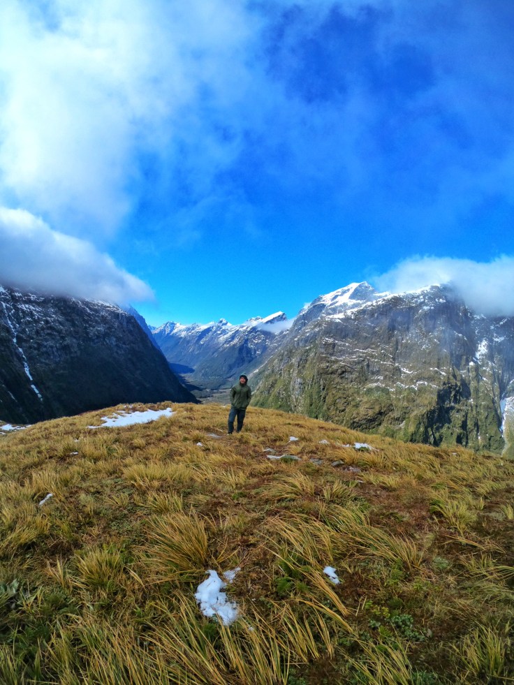Calum Everitt at the top of Mackinnon Pass with views down the Clinton Valley