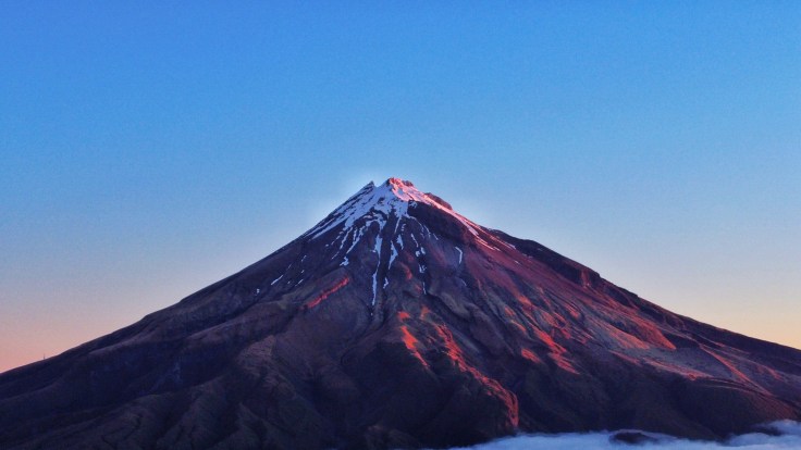 Sunset shines off Mt Taranaki Peak