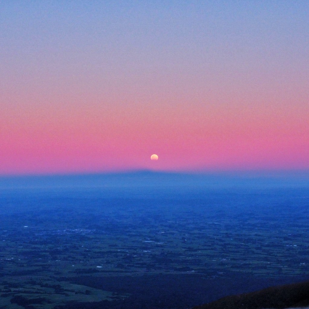 Partial lunar eclipse at sunset
