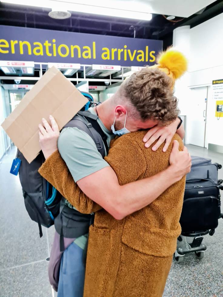 Loving embrace at arrival terminal with my Mother and son