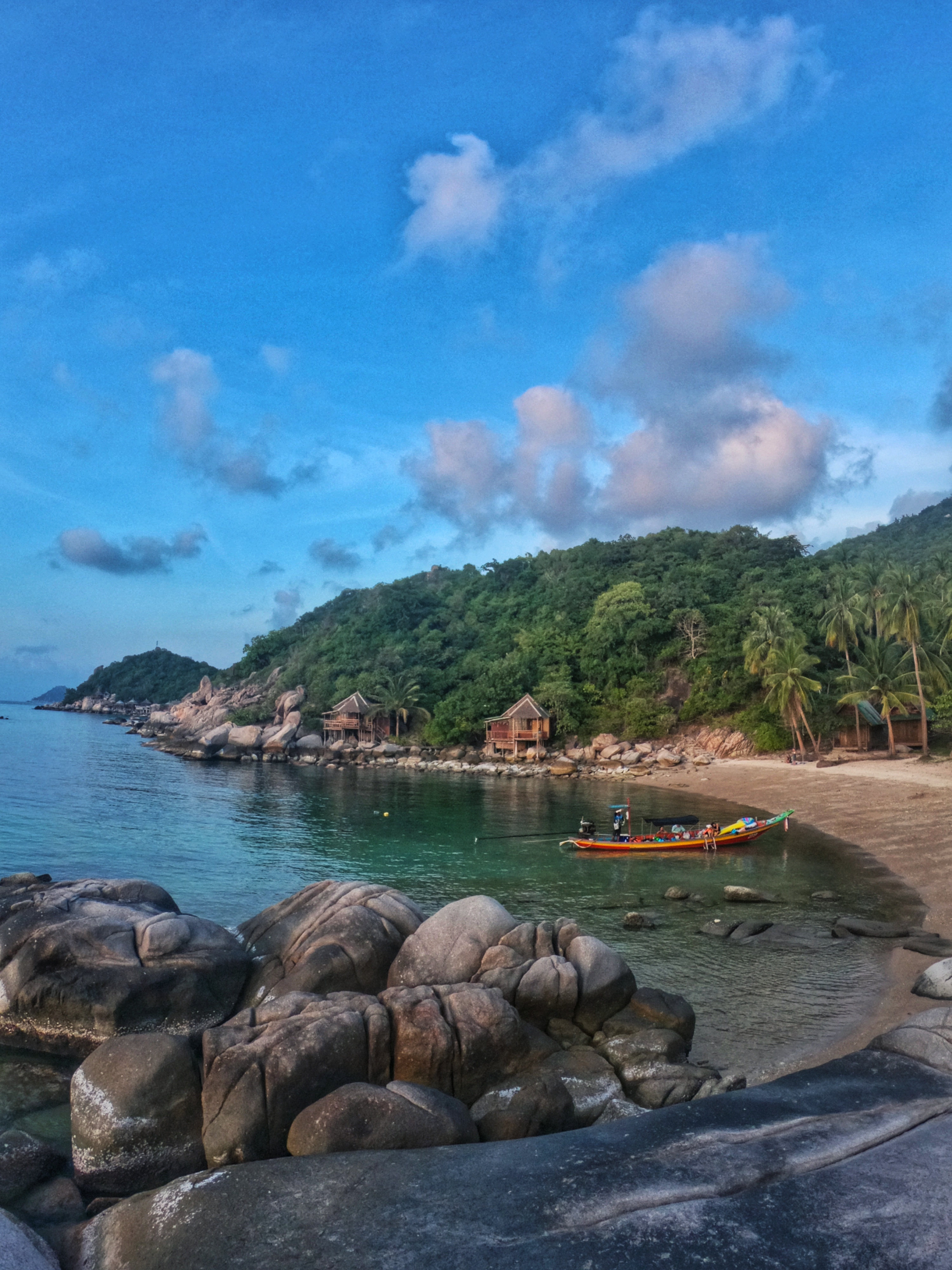 Long Tail boat docks at beach in Koh Tao