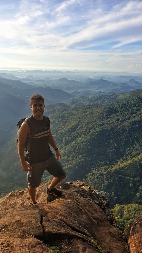 Calum Everitt at the top of Ella Rock