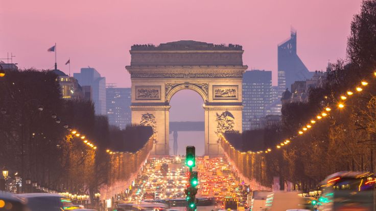 Champs Elysees Paris at dusk looking down to the Arc de Triomphe