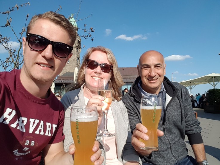 A family enjoy a drink outside at a Hamburg bar