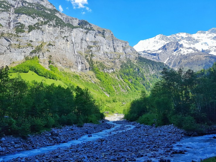 Lauterbrunnen valley, river and snow capped mountains